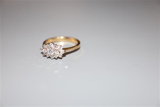 A modern 18ct gold and diamond cluster ring, size M, gross 3.2 grams.